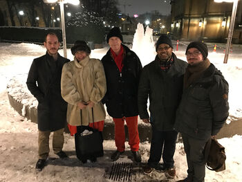 Smile ,Snow ,Social group ,Jacket ,Public space.